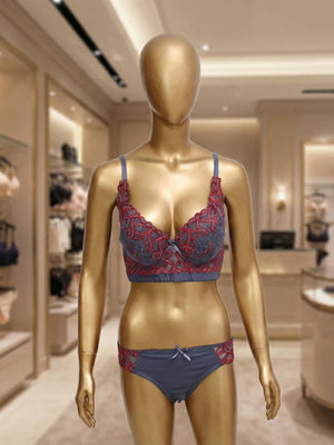 Mannequin wearing a blue and red bra and panties set in a store setting